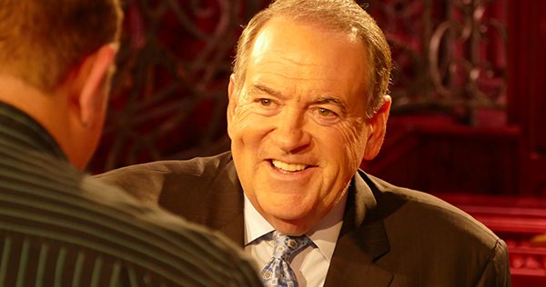 Former Arkansas Governor and presidential candidate Mike Huckabee speaks to DeWayne Hamby near the set of his new TBN show 'Huckabee.'