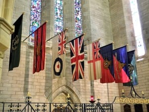 Row of flags hanging inside the Anglican Cathedral of the Most Holy Trinity, Hamilton, Bermuda, 2014 - by ΙΣΧΣΝΙΚΑ-888 (Flags_-_Anglican_Cathedral_of_the_Most_Holy_Trinity_-_Hamilton_Bermuda_2014..jpg) (CC BY-SA 3.0 [https://creativecommons.org/licenses/by-sa/3.0/deed.en]), via Wikimedia Commons