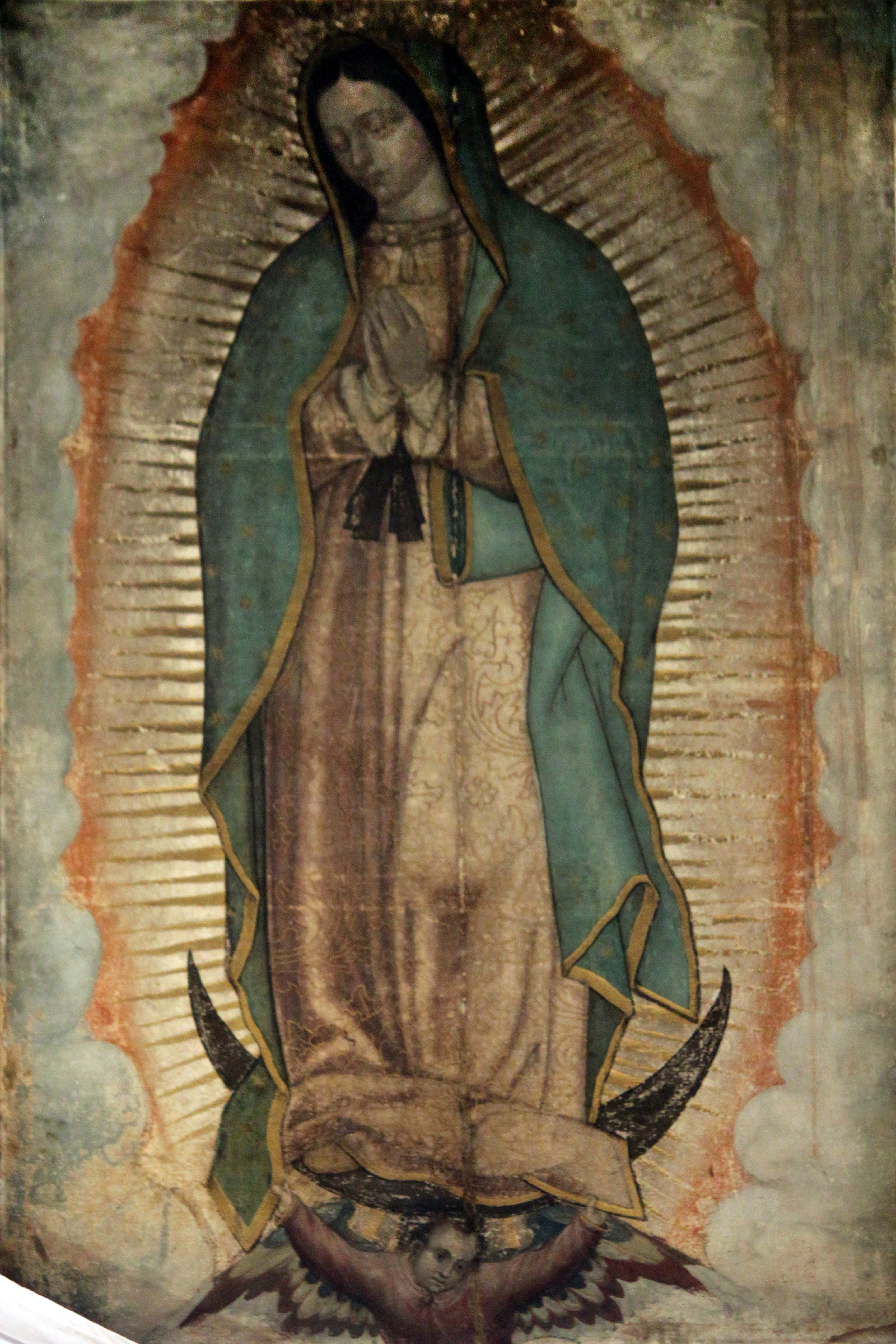 Original Picture of Our Lady of Guadalupe (also known as the Virgin of Guadalupe) shown in the Basilica of Our Lady of Guadalupe in México City. The Catholic Church considers the image of the Virgin of Guadalupe imprinted on the cloak of Juan Diego as a picture of supernatural origin. (PD-Art), via Wikimedia Commons