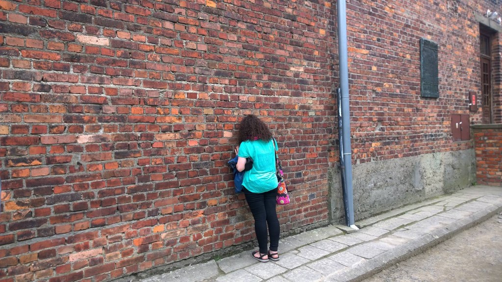 Eugenia praying outside the cell where Fr. Kolbe died (credit: Lawrence Lam)