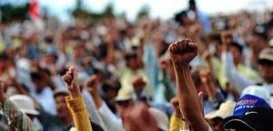 Protest with people raising their fists