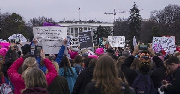 Women showing their own resistance outside the White House on January 21, 2017 (photo Tyler Merbler)