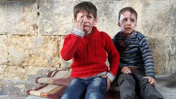 Children in Homs, Syria after an attack.