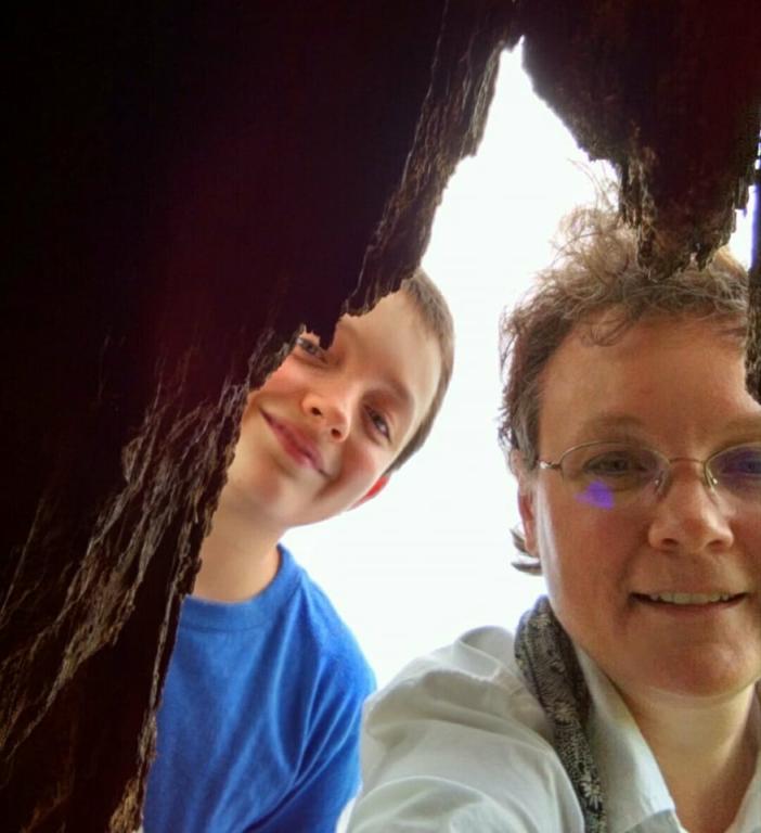 Leah D. Schade and son inspecting tree hollow. Photo credit: Leah D. Schade. All rights reserved.