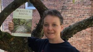 Leah D. Schade with book, Rooted and Rising