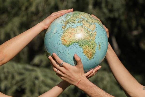 hands holding a globe