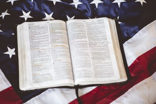 open bible on U.S. flag