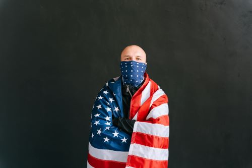 man wrapped in flag