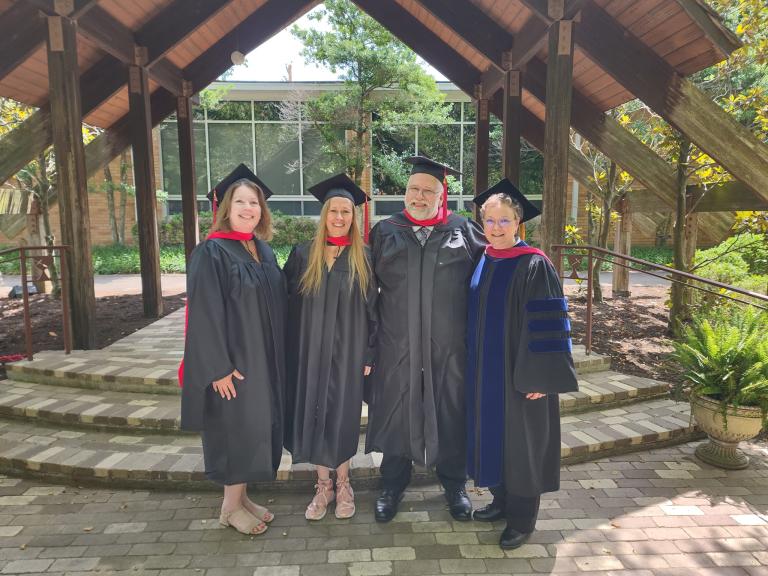 Rev. Dr. Leah D. Schade with graduates from Lexington Theological Seminary, June 2024