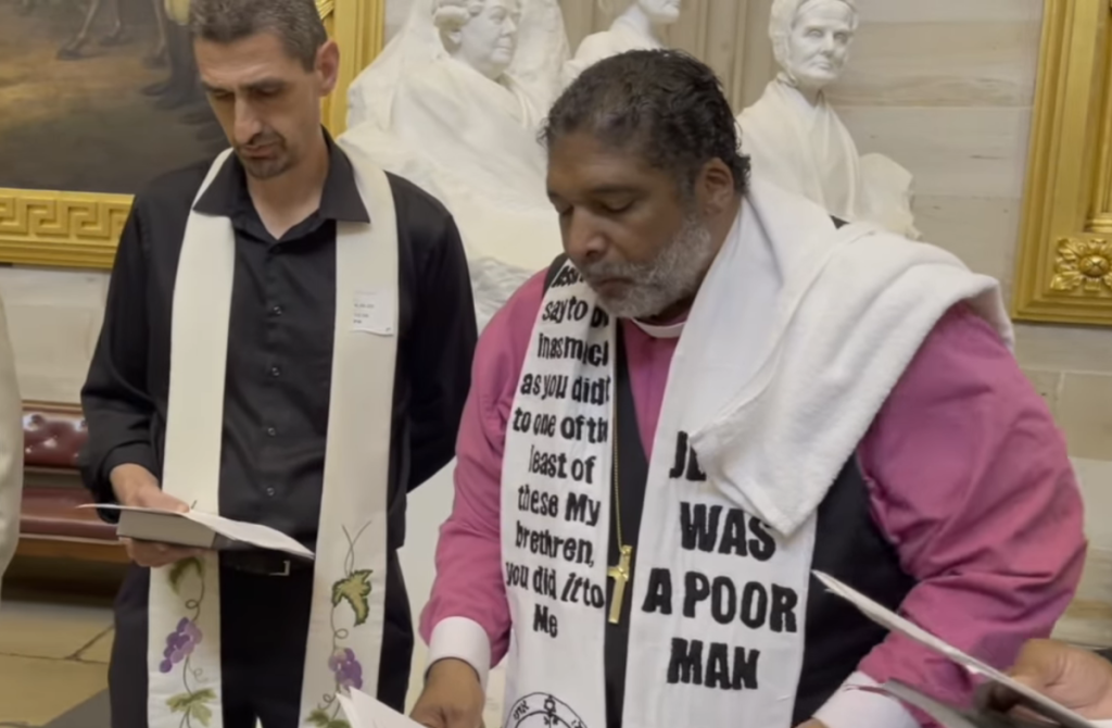 Rev. Dr. William Barber and Rev. Jonathan Wilson-Hartgrove protesting-praying at Capitol Rotunda just before arrest, April 28, 2025.
