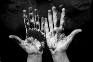 open hands covered in ash
