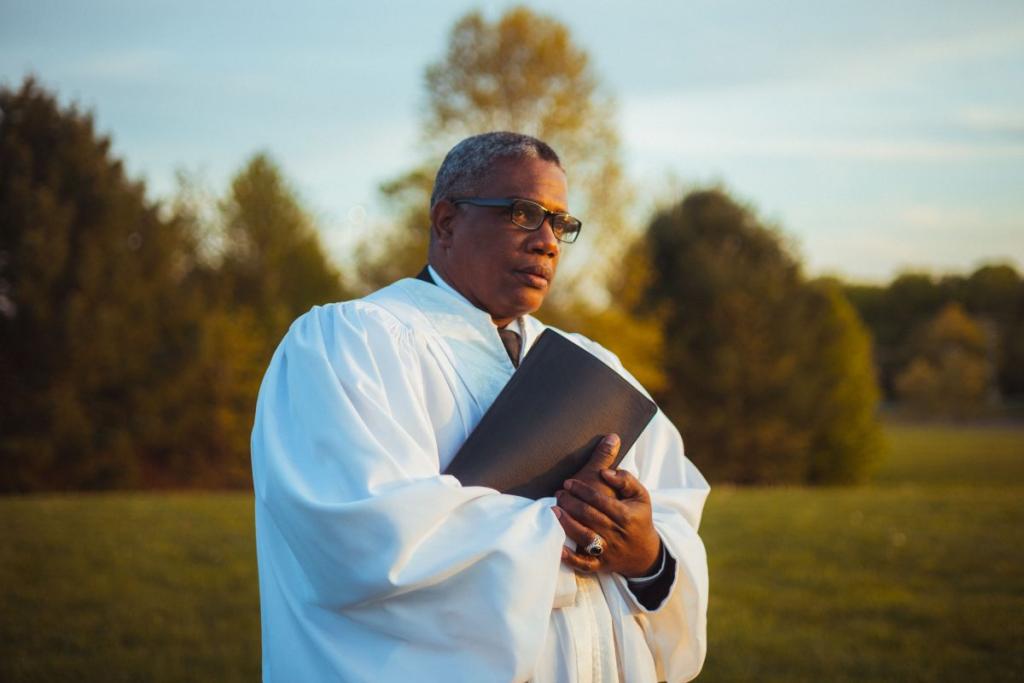 Pastor in robe outside in nature