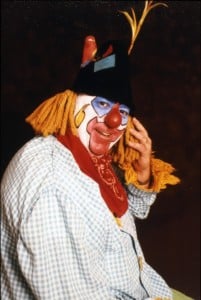 Rev. John Naus, S.J., dressed as Tumbleweed the clown.