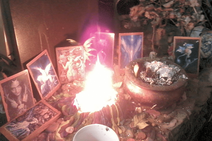 Community fairy altar with oracle cards and offering candle [Morgan Daimler]