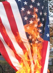 I don't like flag burning. But Trump metaphorically "burns" the flag every day with his actions. Obtained through Creative Commons. 