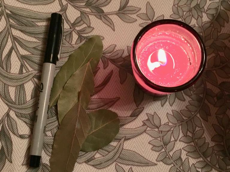 bay leaves, marker, and candle