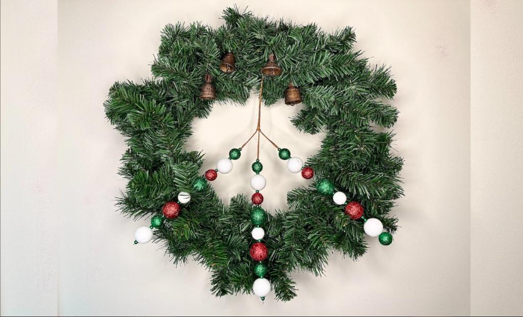 christmas yule solstice peace wreath with evergreen peace sign and bells