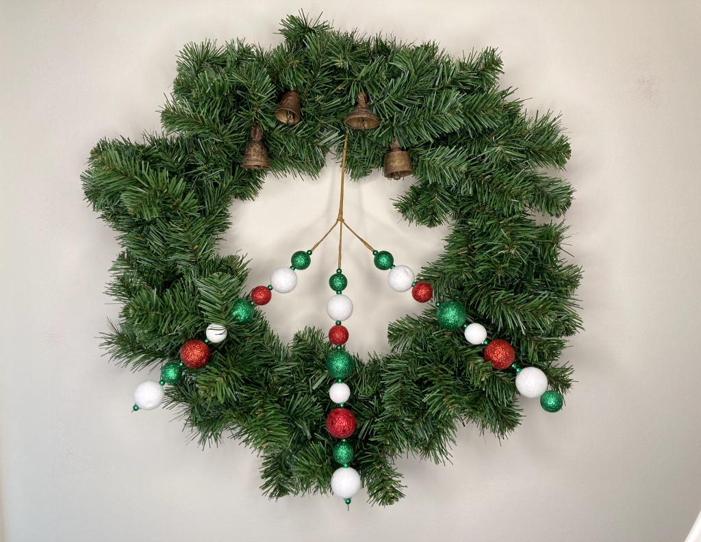 christmas yule solstice peace wreath with evergreen peace sign and bells 