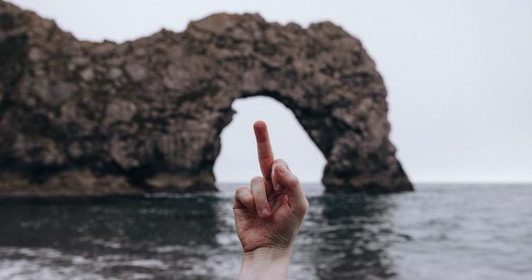 critique, durdle door, middle finger