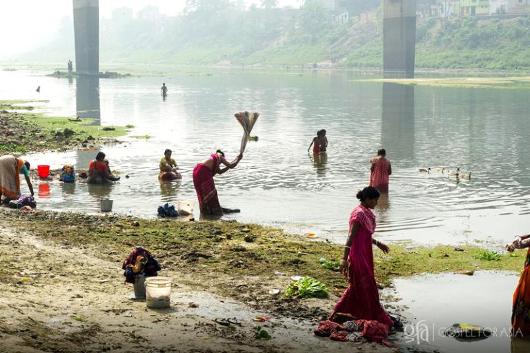 Washing their clothes in this dirty river - KP Yohannan - Gospel for Asia