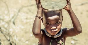 a child carries water in kunene namibia - KP Yohannan - Gospel for Asia