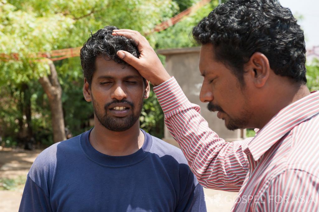 Two men in prayer, helplessly dependent on the Lord - KP Yohannan - Gospel for Asia