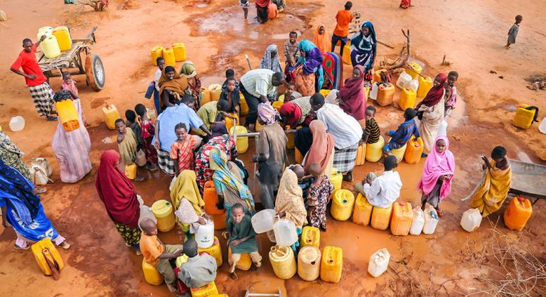 Refugees wait for water in a camp in Dadaab, Somalia - KP Yohannan - Gospel for Asia