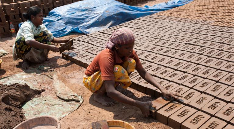 Most people in this woman's village are laborers at a brick factory - KP Yohannan - Gospel for Asia