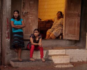 These young women are prostitutes in the red-light district; some most likely entrapped since childhood.