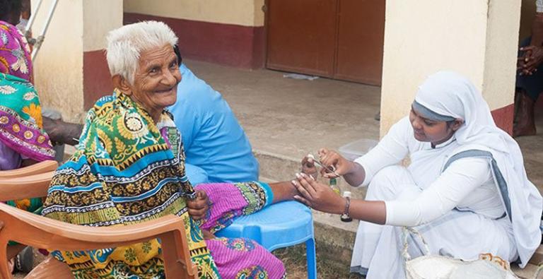 GFA-supported national worker provides medical care to a leprosy patient.