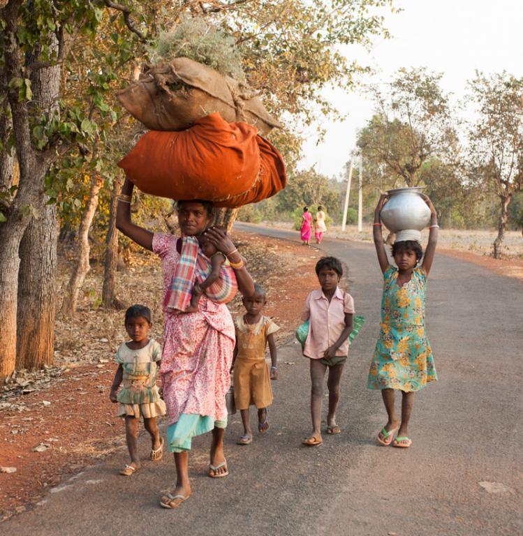 This mother and her five children are returning home from a ten-hour work day in the fields