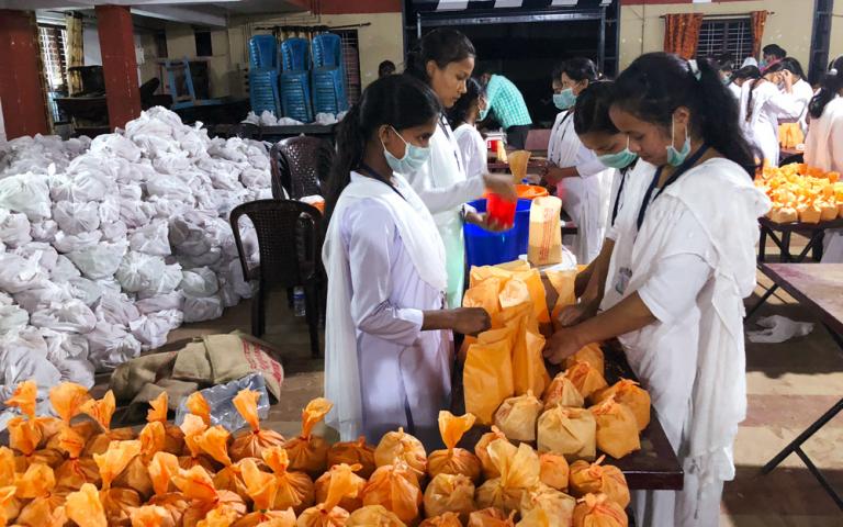 Gospel for Asia-supported workers (in a ministry (founded by Dr. K.p. Yohannan) assisted government relief efforts after the Kerala flooding in August 2018. Here they are assembling packages of food items and other essential supplies to distribute to flood victims.