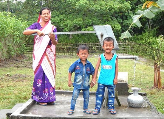 Gospel for Asia founded by Dr. K.P. Yohannan: Salil’s wife and children pumping water from the Jesus Well.