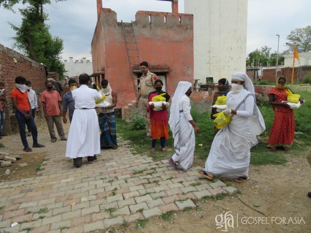 Gospel for Asia (GFA World and affiliates like Gospel for Asia Canada) founded by Dr. K.P. Yohannan: Sisters of Compassion distribute groceries in a slum.