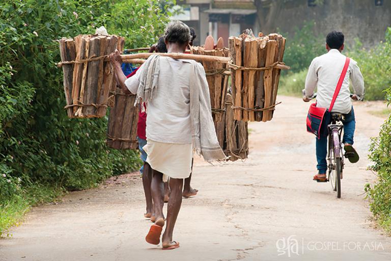 Discussing the hardships of heavy labor & Gospel for Asia who provide a bicycle that helps him support families lessening burdens