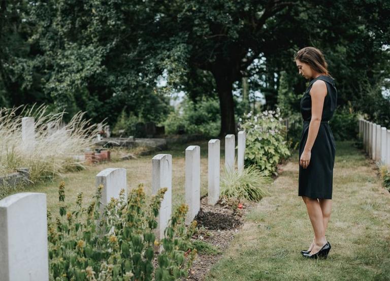 Widow at cemetery