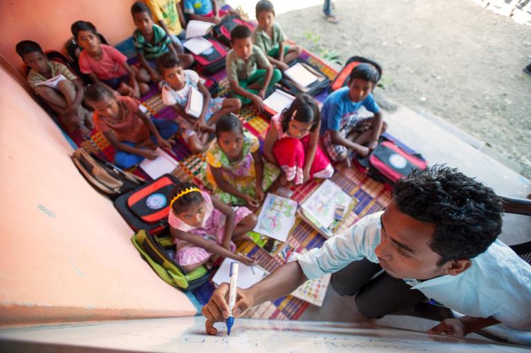 Children listening intently in Bridge of Hope center class