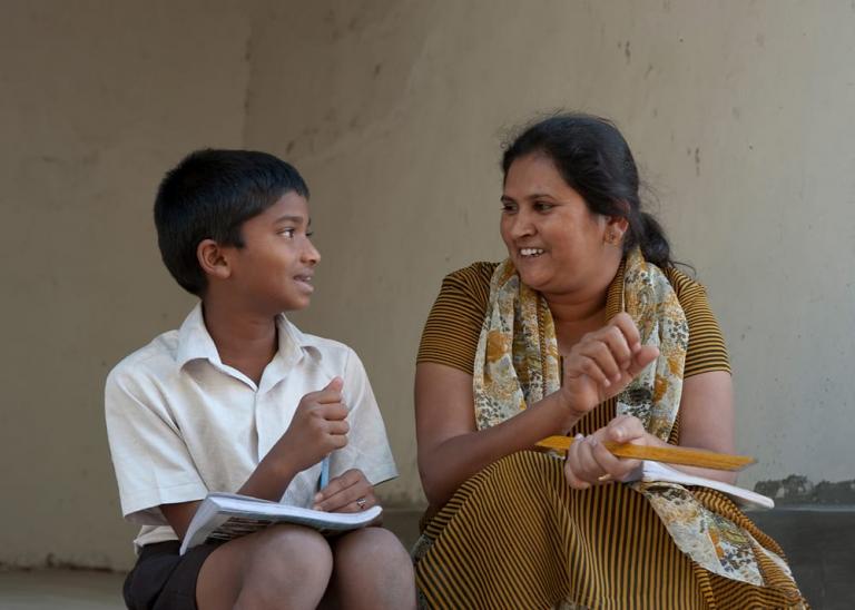 Bridge of Hope teacher with student