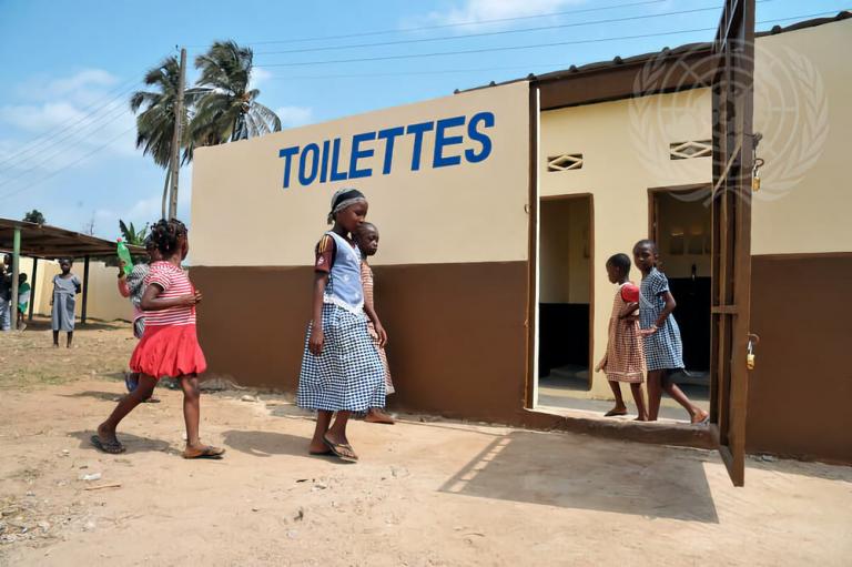 Children investigate new toilet