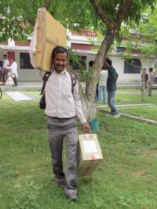 Discussing Gospel for Asia providing sewing machines, tin sheets, smiles and the eternal hope of Jesus through Christmas gift distribution.