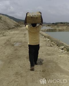 Free Medical Camp supplied by Gospel for Asia: For Pastor Pekelo, it was worth shouldering the heavy box for three miles to give villagers much-needed medicine and loving care.