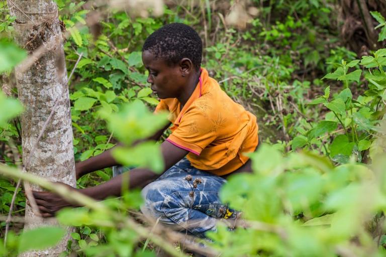 Young boy practifing open defecation