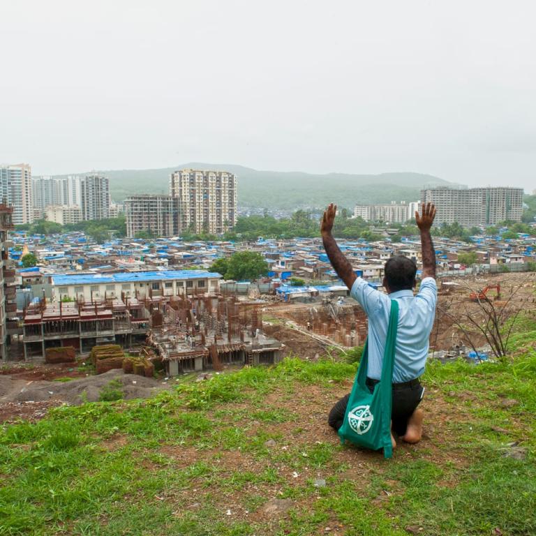 GFA Pastor Marty prays for the people living in the slums