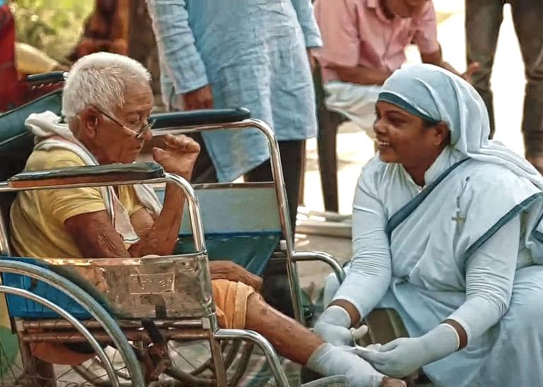 Geeta, Sisters of Compassion, cleans and bandages the wounds of a leprosy patient