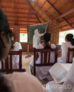 Discussing illiterate Kassia, the poverty, and the GFA Sisters of Compassion who brought a double blessing through a Literacy Class.