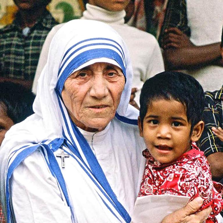 Mother Teresa holding a child