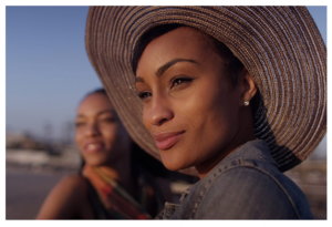 smiling woman in hat