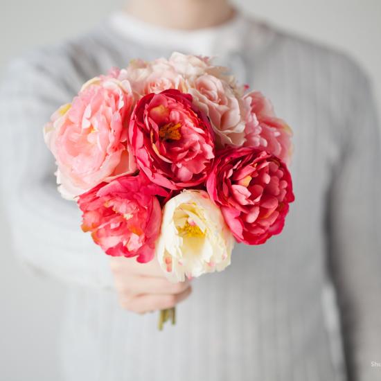 women holding floewrs