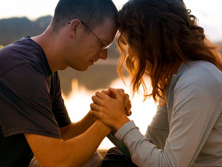 Couple Holding Hands, Heads Togther