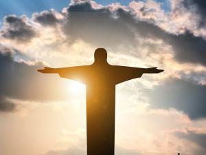Faith-Christian-Jesus-Sky-Statue-Sun-Clouds_credit-Shutterstock